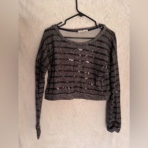 Cute pullover top. Nice addition of sequence stripes to enhance look.